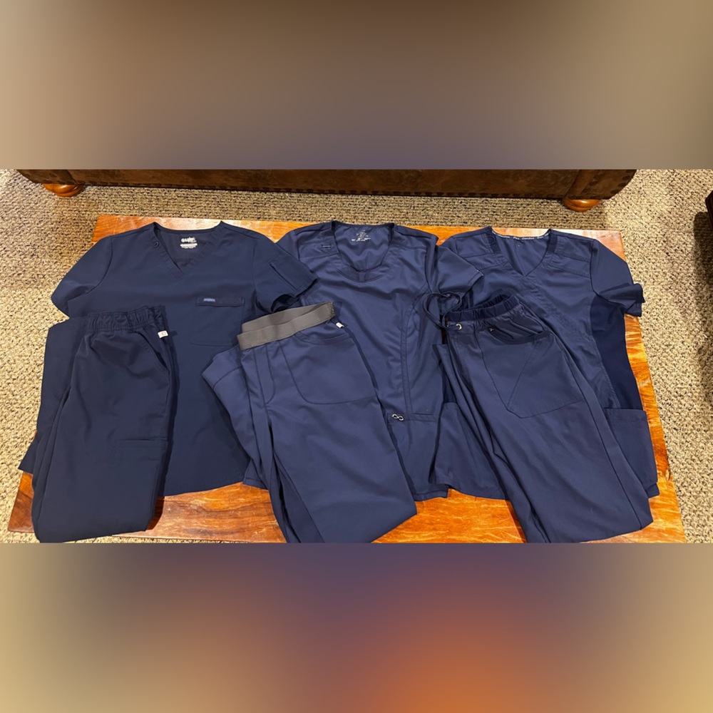 3 sets of Cherokee scrubs. There are 2 sm tops & 1 med top. All bottoms are med